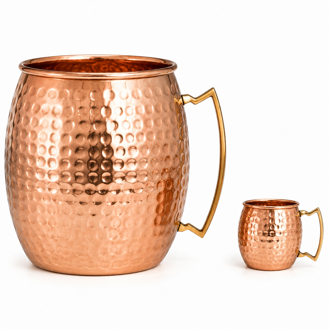 A hammered copper Moscow mule mug with a large handle, shown alongside a smaller matching copper mug on a clean white background.